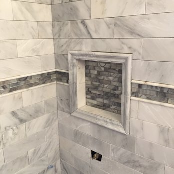 Tim O Tile - a view of a shower with a window - General Contractors Near Me