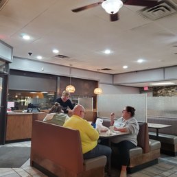two people sitting at a table two people sitting at a table