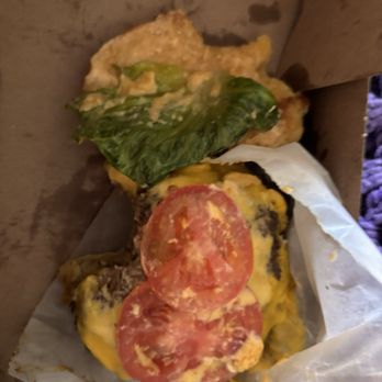 Shake Shack Waterford Lakes - A tiny piece of lettuce, wilted at that on a poorly put together burger - Fast Food Near Me - Orlando, Florida