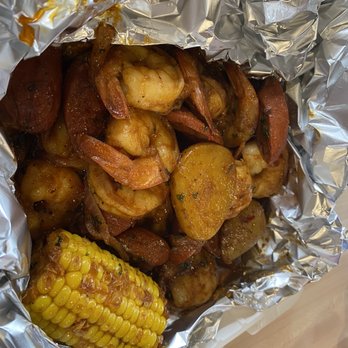 Andre's BBQ And Seafood - Shrimp, corn, potatoes, sausage and onion in this seafood boil - Seafood Near Me - Indianapolis, Indiana Andre's BBQ And Seafood - Shrimp, corn, potatoes, sausage and onion in this seafood boil - Seafood Near Me - Indianapolis, Indiana