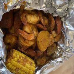 Andre's BBQ And Seafood - Shrimp, corn, potatoes, sausage and onion in this seafood boil