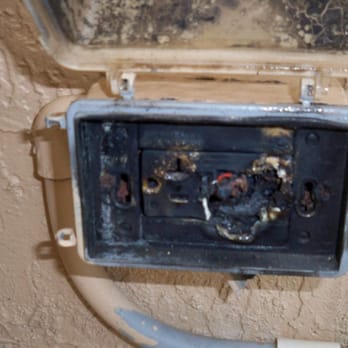 Feldi's Building Inspections - exterior gfci outlet shorted and burned - Home Inspectors Near Me