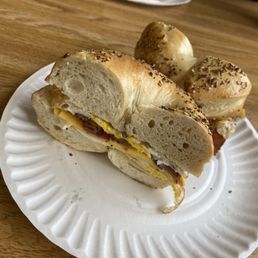 a breakfast sandwich on a paper plate a breakfast sandwich on a paper plate