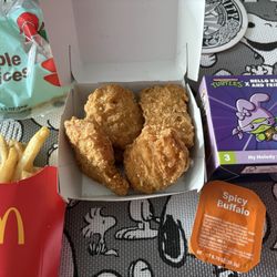 McDonald's - chicken mcNuggets happy meal, kid-sized fries, Apple Slices, happy meal toy