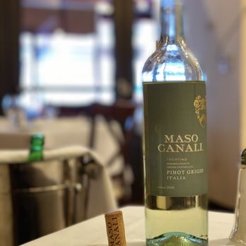 Bottega Restaurant - a bottle of wine and salt shaker - Italian Near Me - New York, New York Bottega Restaurant - a bottle of wine and salt shaker - Italian Near Me - New York, New York