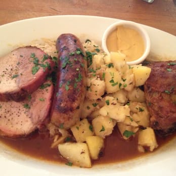 Leopold's - Choucroute garni platter with pork ribs, smokes pork loin and house made bratwurst with sauerkraut - German Near Me - San Francisco, California Leopold's - Choucroute garni platter with pork ribs, smokes pork loin and house made bratwurst with sauerkraut - German Near Me - San Francisco, California