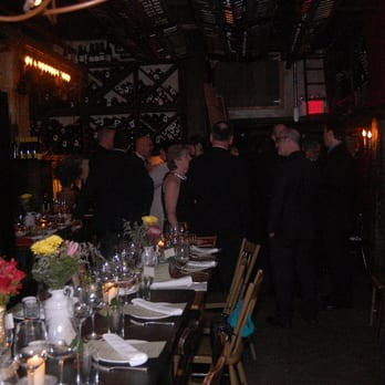 Il Buco - Table shown from back of room looking to front. This is while hors d'oeuvres were being served before the meal started. - Italian Near Me - New York, New York
