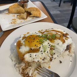 loco moco and empanadas in the back