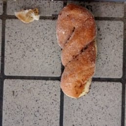 Busken donut on floor covered with all kinds of ants Busken donut on floor covered with all kinds of ants