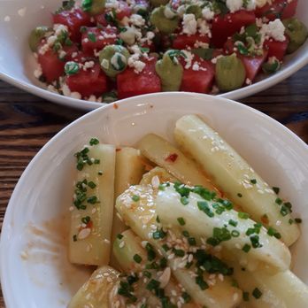Sacred Beast - Marinated cucumbers in the front, watermelon and feta salad in the back - Bars Near Me - Cincinnati, Ohio Sacred Beast - Marinated cucumbers in the front, watermelon and feta salad in the back - Bars Near Me - Cincinnati, Ohio