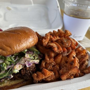 Laveta - Crispy chicken sandwhich with sweet potato fries - so good! Pricey but worth it. I also got the chai latte iced with almond milk - Coffee & Tea Near Me - Los Angeles, California