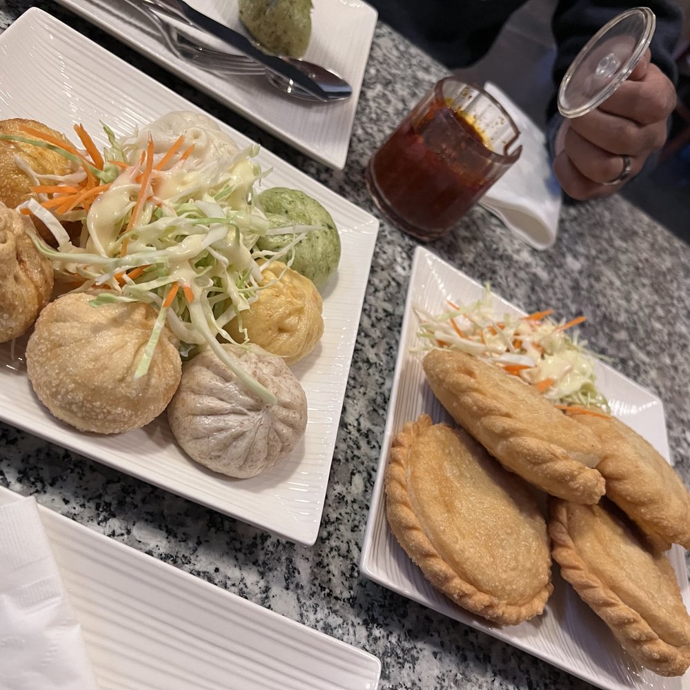 A mix of steamed and fried momos and sha-bhaley