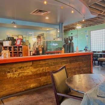 Bennu Coffee - a man sitting at a table - Coffee & Tea Near Me - Austin, Texas Bennu Coffee - a man sitting at a table - Coffee & Tea Near Me - Austin, Texas