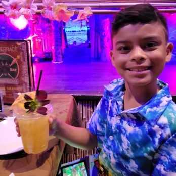 The Tiki Terrace - Even my son's pineapple juice looked fancy. - Hawaiian Near Me - Des Plaines, Illinois