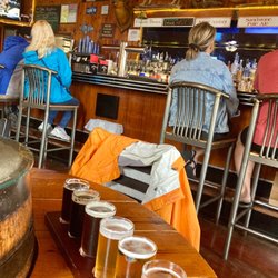 Lake Superior Brewing Co At Dunes Saloon - Beer flight with the bar behind.