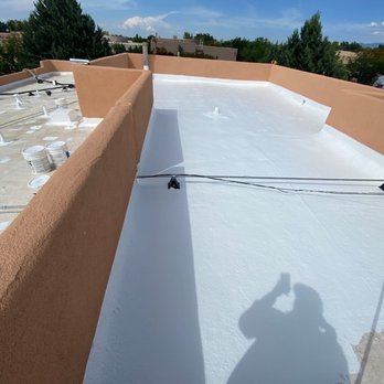 Paramount Roofing - Close-up shot of the high-quality silicone material used in our roof coating process. - Roofing Near Me - Albuquerque, New Mexico Paramount Roofing - Close-up shot of the high-quality silicone material used in our roof coating process. - Roofing Near Me - Albuquerque, New Mexico