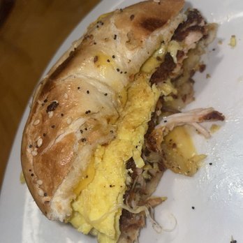 The Roost - Everything Bagel Sandwich with scrambled eggs, cheddar jack cheese and Nashville hot chicken - Breakfast & Brunch Near Me - Indianapolis, Indiana The Roost - Everything Bagel Sandwich with scrambled eggs, cheddar jack cheese and Nashville hot chicken - Breakfast & Brunch Near Me - Indianapolis, Indiana