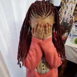 Cornrows and individual braids in the back with beads - nice young lady style