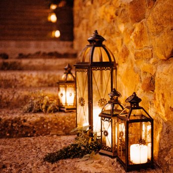 Back Patio Event Design - They made sure our venue's stone stairway was filled with these beautiful lanterns with real candles! - Wedding Planning Near Me