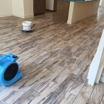 Abba Tile - a blue blow dryer on the floor - Tiling Near Me - Santa Ana, California