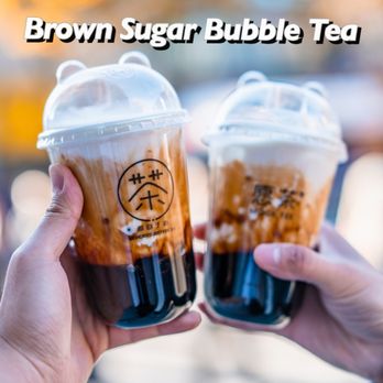 Moge Tee UIUC - two people holding cups of brown sugar bubble tea - Bubble Tea Near Me - Champaign, Illinois