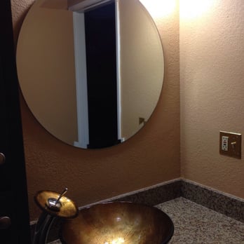 Greencollar Construction - New granite slab with vessel and round beveled mirror. - General Contractors Near Me - Long Beach, California