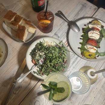 Capri Lasagneria - Caprese salad and Arugula salad plus Negroni and Hugo Spritz to drink! - Italian Near Me - Burlingame, California Capri Lasagneria - Caprese salad and Arugula salad plus Negroni and Hugo Spritz to drink! - Italian Near Me - Burlingame, California