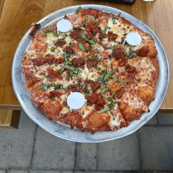 Toppers Pizza Place - Toppers Exquisite version of A margarita pizza with sun dried tomatoes!! Must try!! - Pizza Near Me - Ventura, California Toppers Pizza Place - Toppers Exquisite version of A margarita pizza with sun dried tomatoes!! Must try!! - Pizza Near Me - Ventura, California