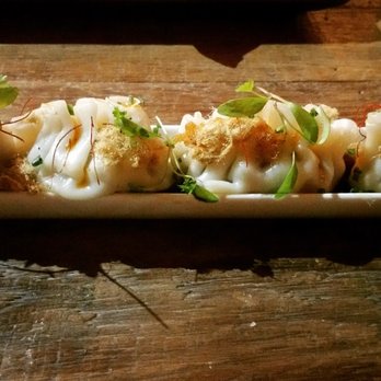 Brighton Bodega - Pork dumplings topped off with "shoestring" pork, serve in a Sichuan sauce - 4.5/5 stars - Cocktail Bars Near Me - Brighton, Massachusetts Brighton Bodega - Pork dumplings topped off with "shoestring" pork, serve in a Sichuan sauce - 4.5/5 stars - Cocktail Bars Near Me - Brighton, Massachusetts