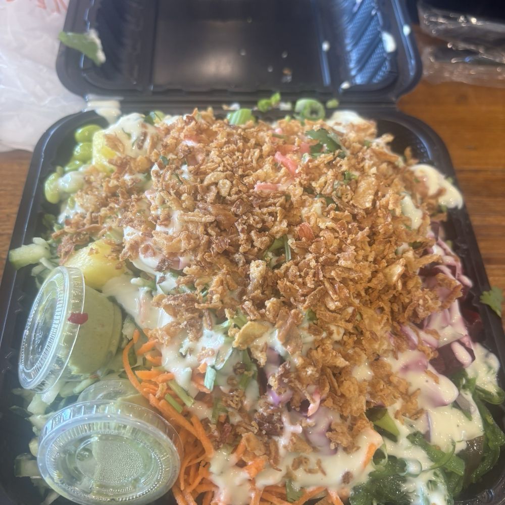 The big kahuna poke bowl with salmon and toppings of choice