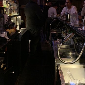 La Linea - a bar with people sitting at the bar - Lounges Near Me - New York, New York