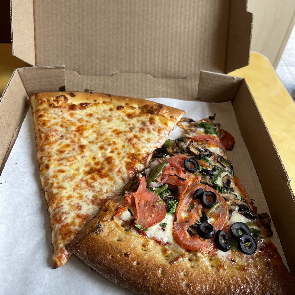 Blondie’s Pizza - two slices of pizza in a box - Pizza Near Me - Berkeley, California Blondie’s Pizza - two slices of pizza in a box - Pizza Near Me - Berkeley, California