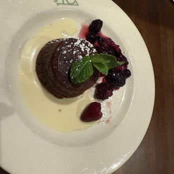 Reata - Chocolate lava Molten Cake with Drunken Berries - New American Near Me - Fort Worth, Texas Reata - Chocolate lava Molten Cake with Drunken Berries - New American Near Me - Fort Worth, Texas