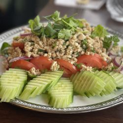 NaPha Thai Kitchen - Labb Gai Cooked minced chicken tossed with red onion,
fresh mint, toasted rice, chili, lime and served
with fresh lettuce and cucumber
