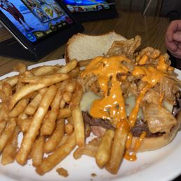 a plate of french fries and a cheeseburger a plate of french fries and a cheeseburger