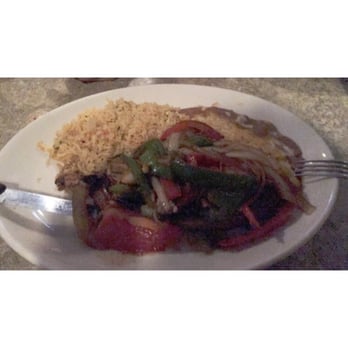 La Bamba Mexican Spanish Restaurant Margate - Tijuana Steak: New York strip with sautéed onions & red/green peppers with yellow rice & refried beans - Spanish Near Me - Margate, Florida La Bamba Mexican Spanish Restaurant Margate - Tijuana Steak: New York strip with sautéed onions & red/green peppers with yellow rice & refried beans - Spanish Near Me - Margate, Florida