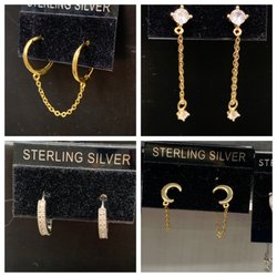 Village Streetwear - Endless selection of earrings if all shapes and sizes! Stop in so we can help create a fabulous ensemble just for you!