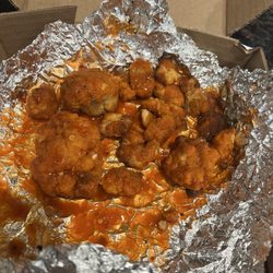 Blackjack Pizza & Salads - Burnt pieces of chicken for boneless wings. Ridiculous.