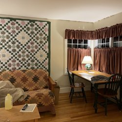 The Country Inn at Camden Rockport - Living room with futon, dining table