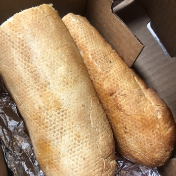 Barro's Pizza - Two bottom halves of a roll for the very dry garlic bread with cheese - Pizza Near Me - Tempe, Arizona Barro's Pizza - Two bottom halves of a roll for the very dry garlic bread with cheese - Pizza Near Me - Tempe, Arizona