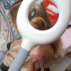 Vanilla Lice - Lice Treatment Services - Removing tiny nits with the use of a magnifier.