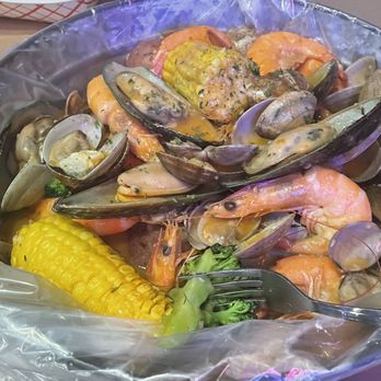 Cajun Boil - Shrimp, clams and muscles with garlic Cajun mild sauce. Side of corn, potatoes and broccoli. - Cajun/Creole Near Me - Miami, Florida
