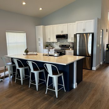 Williams Remodel - a kitchen with a center island - General Contractors Near Me - Lake Worth, Florida