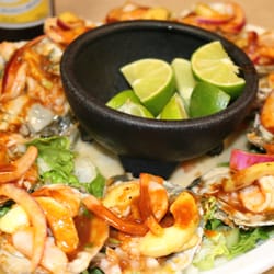 Mi Taqueria El Kiosko 2 - Ostiones El Kiosko Oysters Topped with red or green aguachiles and our signature Black Mariscos sauce