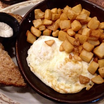 Another Broken Egg Cafe - Two eggs over medium with a side of home fries. - Breakfast & Brunch Near Me - Burbank, California Another Broken Egg Cafe - Two eggs over medium with a side of home fries. - Breakfast & Brunch Near Me - Burbank, California