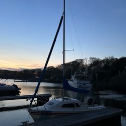 Brick Cove - My sailboat at a slip at dusk.