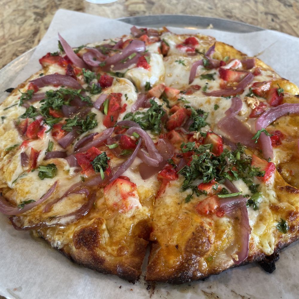 Butter Curry personal pizza in the standard "specialty" toppings ($10). Butter Curry personal pizza in the standard "specialty" toppings ($10).