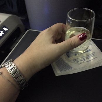 United Airlines - Plenty of Champagne flowing in First Class. - Airlines Near Me - Honolulu, Hawaii United Airlines - Plenty of Champagne flowing in First Class. - Airlines Near Me - Honolulu, Hawaii
