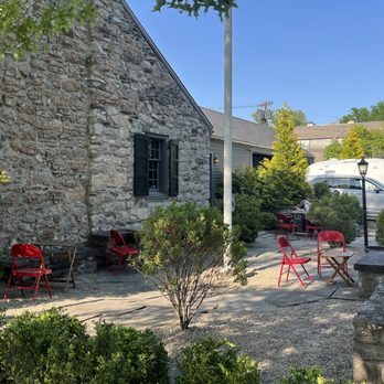 Salt Box - a patio with red chairs and tables - Bars Near Me - Kingston, New York Salt Box - a patio with red chairs and tables - Bars Near Me - Kingston, New York
