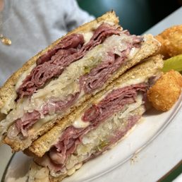 Reuben sandwich with Cajun tots